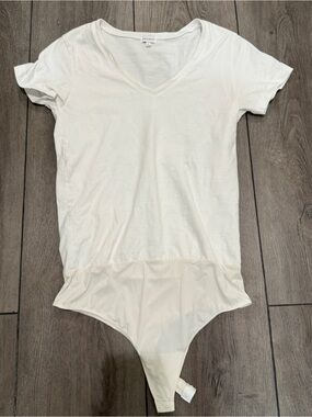 Ambition size medium, white T-shirt, bodysuit